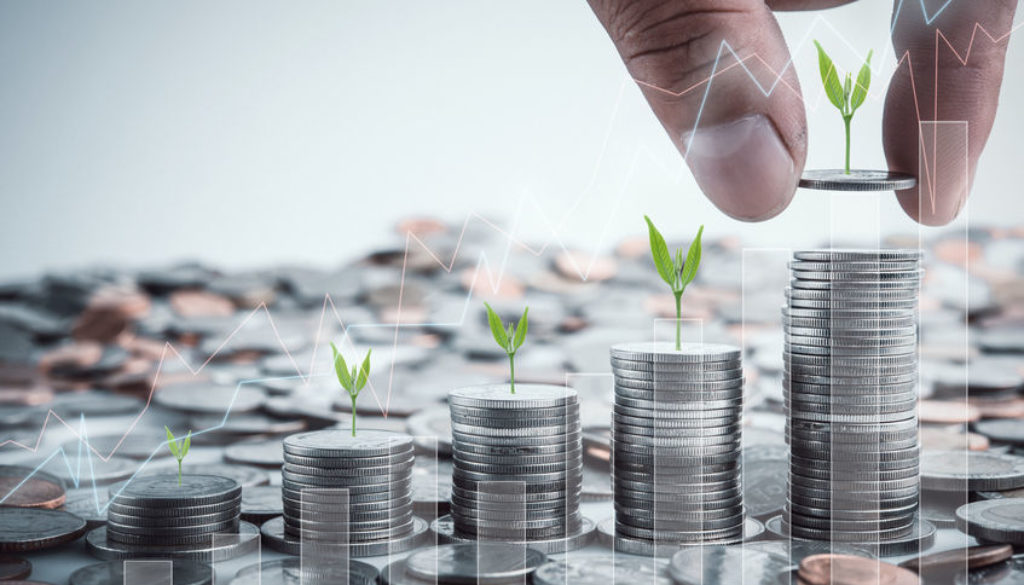 Male hand putting coins with money stack step growing growth sav