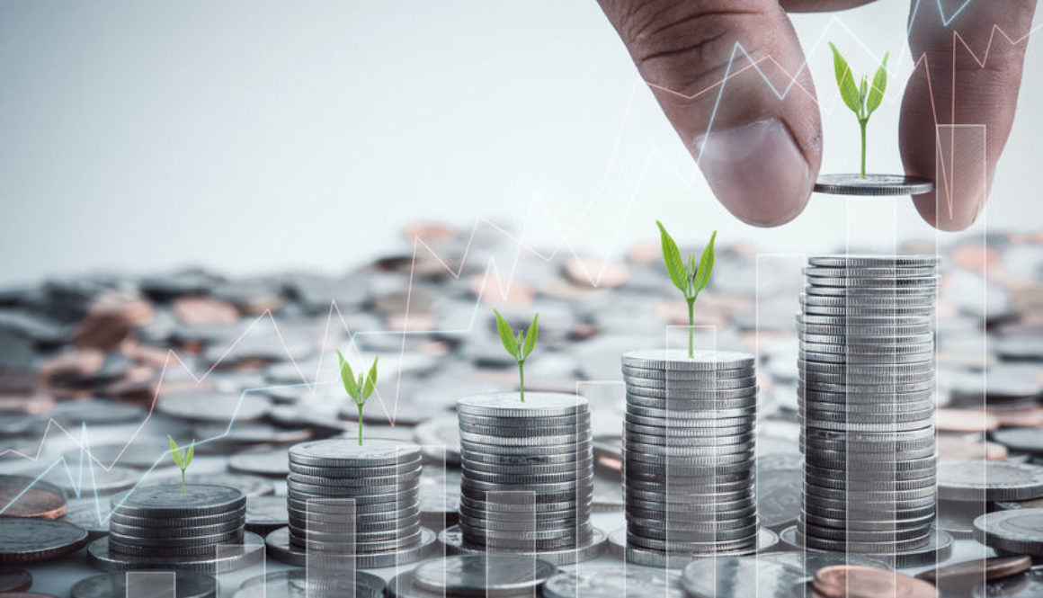 Male hand putting coins with money stack step growing growth sav