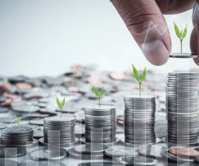 Male hand putting coins with money stack step growing growth sav