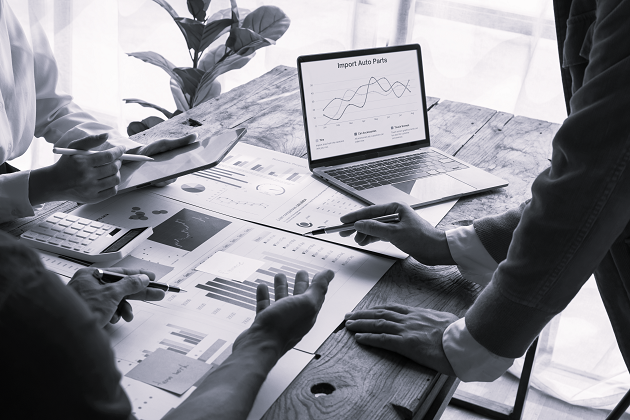 group-of-confident-business-people-point-to-graphs-2025-02-22-16-15-22-utc-edit-1